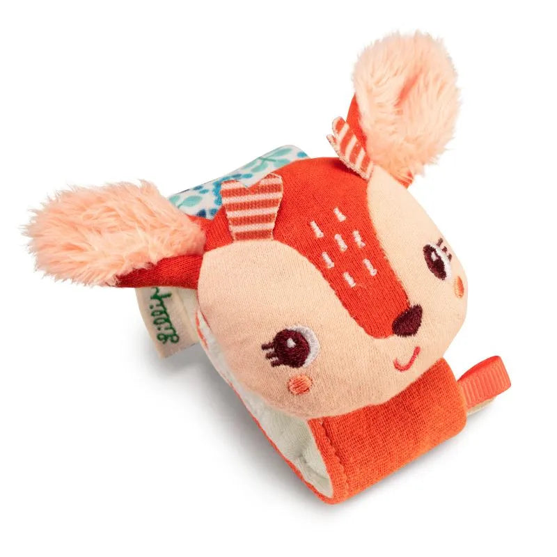 The Lilliputiens I'm Discovering Stella Bracelet Rattle is a soft, plush deer-shaped toy with peachy ears, a cute face, embroidered details, and a colorful strap. It makes an ideal baby toy or rattle bracelet and is perfect as a charming birth present.