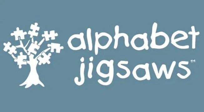 Logo of Alphabet Jigsaw beside a tree bearing smll jigsaw fruit. All within a grey rectangle.