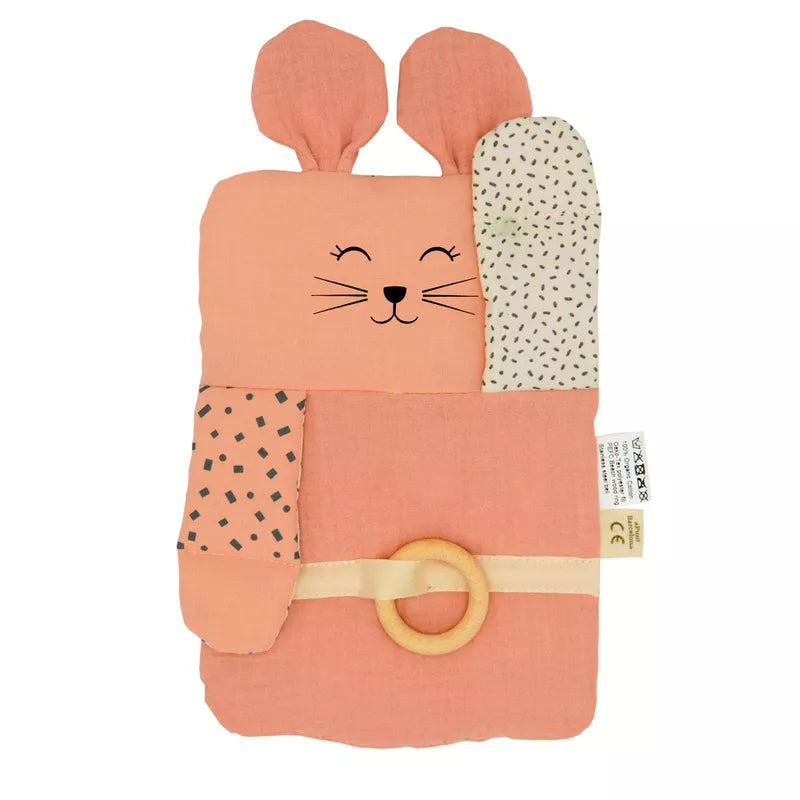 a pink and black mouse shaped towel with a ring on it.