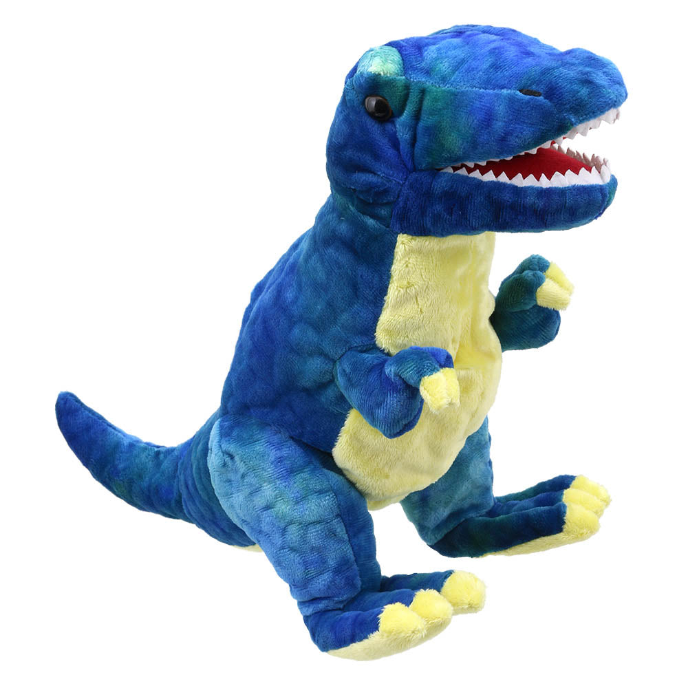 Introducing the Baby T-Rex Blue from The Puppet Company, a plush toy featuring a striking blue color with yellow accents. It showcases an open mouth and visible teeth, standing upright with charming small arms and large feet. Crafted from textured, soft fabric, this toy is ideal for bringing a dinosaur storybook to life.