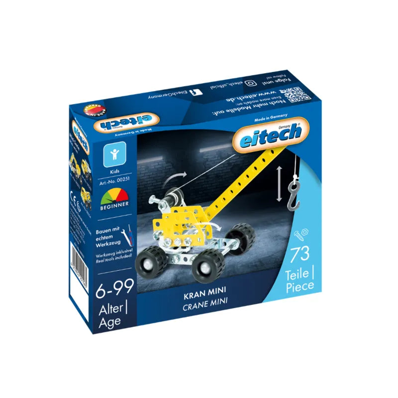 A blue box of the Eitech Construction Mini Crane metal set features a wheeled crane with a hook. The building kit includes 73 pieces and is suitable for ages 6 to 99.