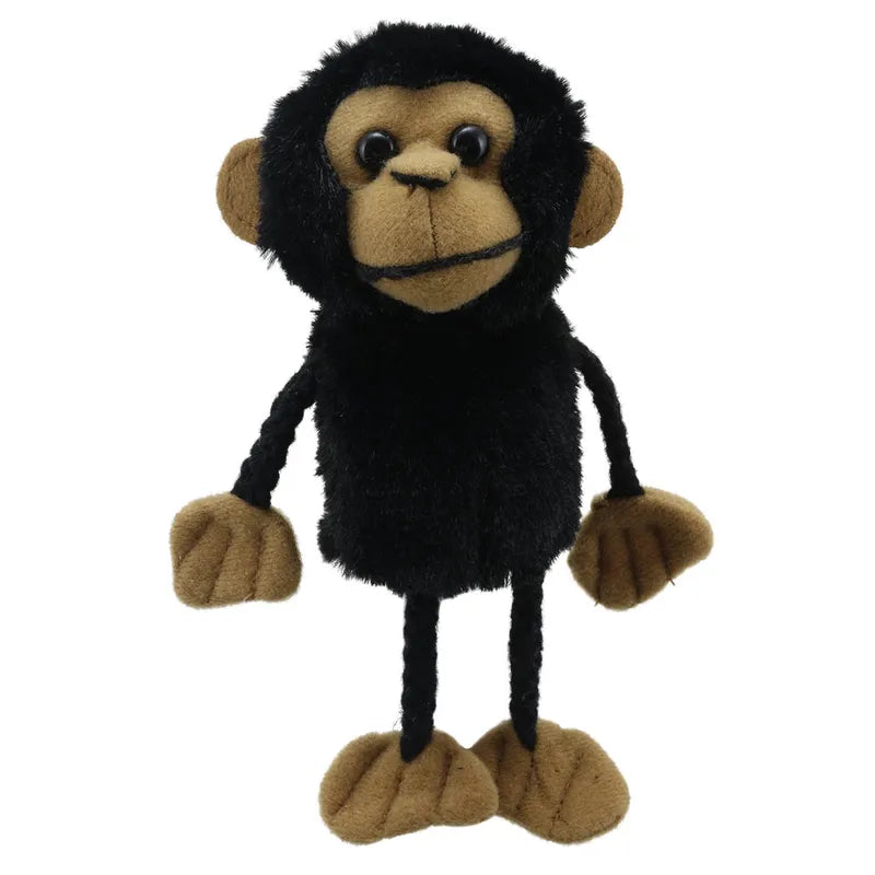 The Puppet Company Chimp Finger Puppet features a black fuzzy body, brown face, hands, feet, and ears, with button eyes and a stitched smile—perfect for storytelling—and stands upright against a white background.
