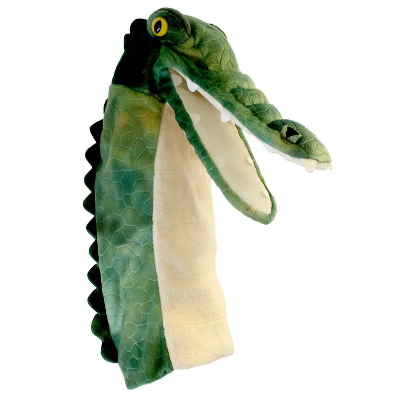 The Puppet Company Long Sleeved Puppet Crocodile boasts a plush green and white design with textured skin, visible teeth, and round yellow eyes for a lifelike appearance, featuring an open mouth that adds charm to imaginative play.