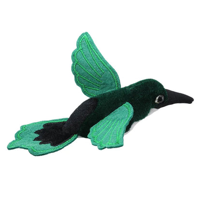 The Puppet Company Finger Puppet Hummingbird Green features vibrant green wings and tail, a black beak, and a dark body. Its slightly open wings and shiny, round eye are perfect for storytelling adventures.