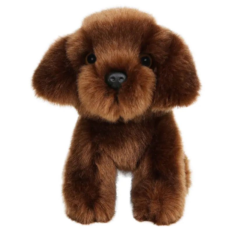 The Wilberry Mini Brown Labrador is a plush toy dog with soft brown fur, large black eyes, and floppy ears. This cuddly Labrador faces forward and is perfect for snuggling.
