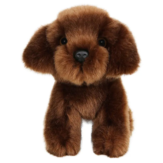 The Wilberry Mini Brown Labrador is a plush toy dog with soft brown fur, large black eyes, and floppy ears. This cuddly Labrador faces forward and is perfect for snuggling.