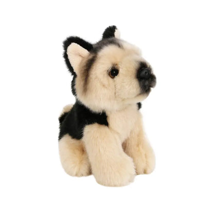 The Wilberry Mini German Shepherd is an adorable soft toy featuring light tan fur, black markings on its back and face, and dark eyes. Sitting upright on a white background, this cute plush is a perfect gift for children.