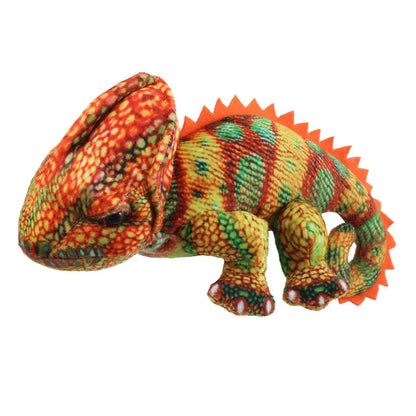 The Puppet Company Orange Chameleon Finger Puppet from the Little Creatures Range features a playful design with red, orange, green, and yellow patterns, spiky orange felt along its back, and a curled tail against a white background.