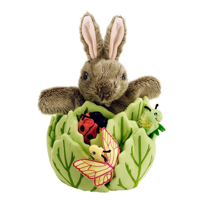The Puppet Company Hide-Away Rabbit features a soft rabbit in a lettuce house, with plush finger puppets—a ladybug, caterpillar, and yellow butterfly—nestled among the green leaves.