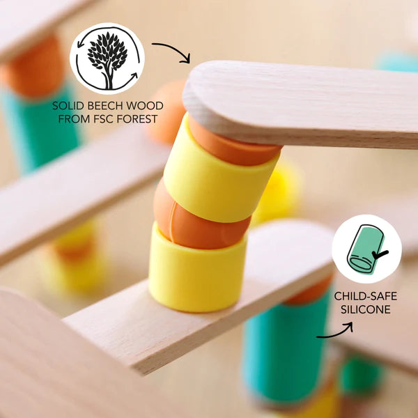 A Stix Building Game that promotes fine motor skills and creativity, featuring a wooden structure adorned with vibrant yellow, orange, and green hues.
