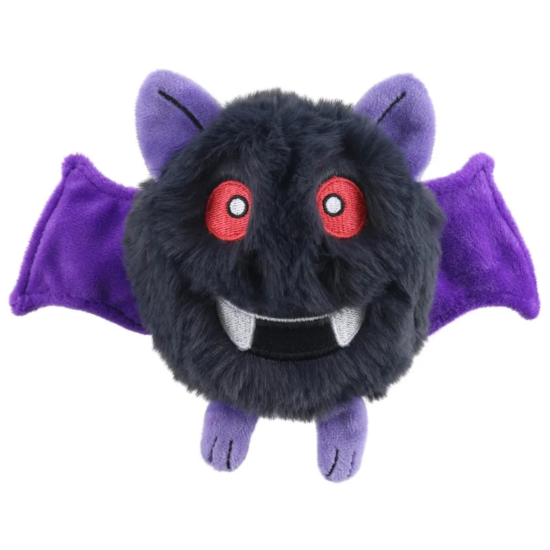 The Swoop Micro Monster Finger Puppet by The Puppet Company is a round, fluffy black plush with red eyes, white fangs in its smile, purple bat wings and ears, and small purple feet—your perfect cuddly companion on a white background.