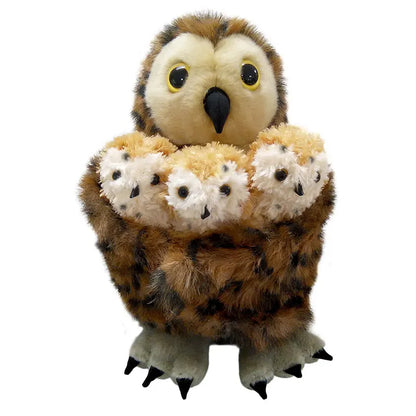 The Puppet Company Hide-Away Tawny Owl puppet holds three owlet finger puppets in its wings. These brown, spotted toys have large yellow eyes and soft, fluffy textures, perfect for imaginative play against a white background.