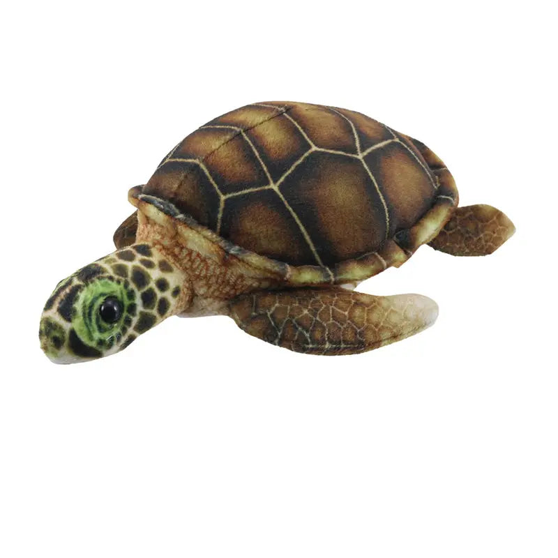 The Puppet Company Turtle Finger Puppet from the Little Creatures Range features a brown, hexagon-patterned shell with green and yellow accents on its head and flippers, displayed on a white background.
