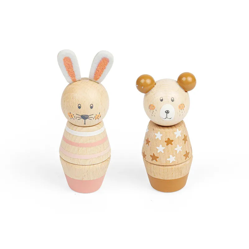The Twist and Match Bear and Bunny features two wooden animals on a white background: a bunny with long ears in a striped pink outfit and a bear with round ears in a star-patterned outfit. Crafted from FSC Certified wood, they have painted faces, perfect for enhancing fine-motor skills in little hands.