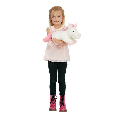 A young girl with blonde hair, dressed in a pink sleeveless top, black pants, and pink boots, stands holding The Puppet Company Full-bodied Hand Puppet Unicorn against a plain white background.