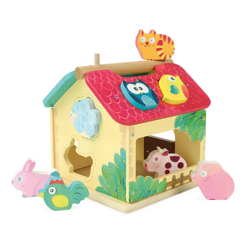The Vilac Farm With Shapes is a colorful wooden toy shaped like a small house with a vibrant red roof. Ideal for children aged 2 and older, the roof features cut-out shapes of animals such as an owl, cat, and bird. Various animal blocks—including a rabbit, chicken, cow, pig, and rooster—surround the house and match these cut-out shapes.