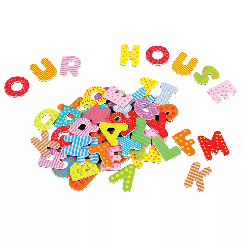 A pile of New Classic Toys Magnetic Alphabet Letters.