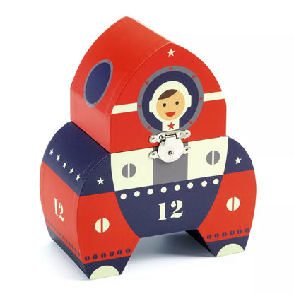 A Djeco Musical Box Polo 12 with an astronaut on it.